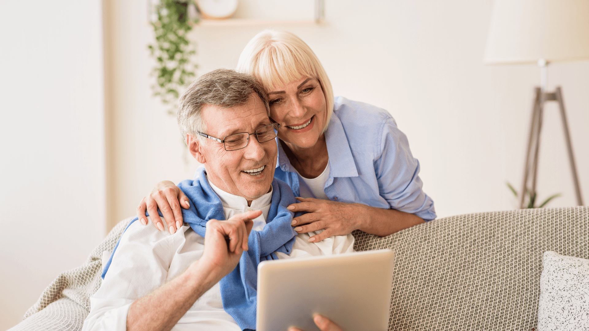 Older couple looking at their iPad